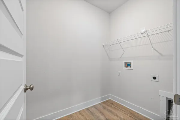 a kitchen with stainless steel appliances a refrigerator and a stove top oven