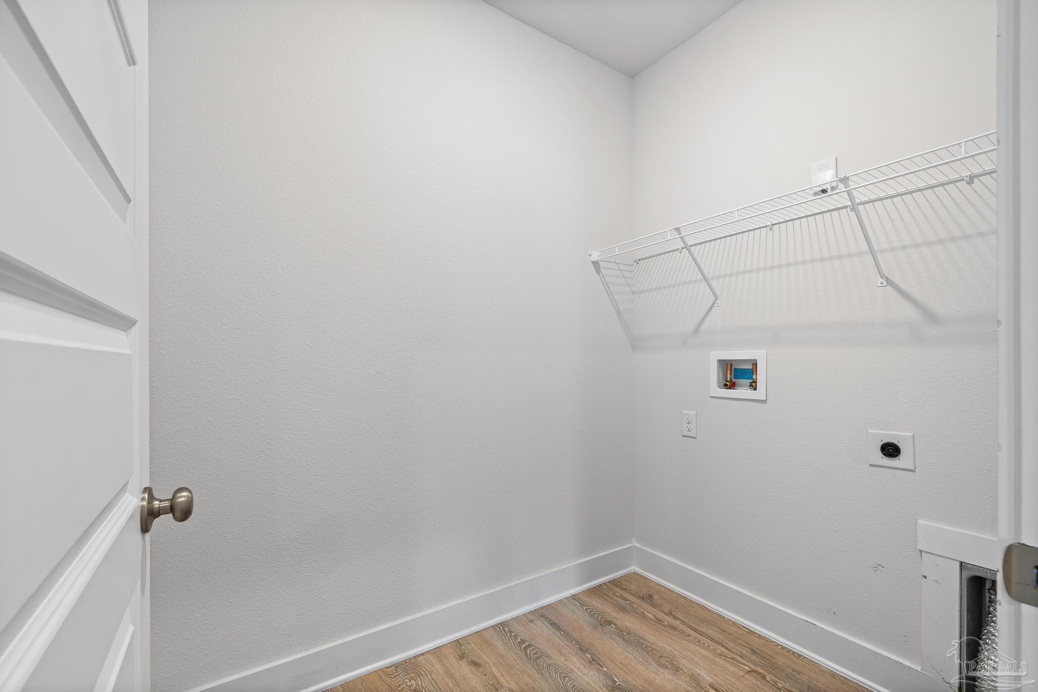 4074 Blaney Lane Pace, FL 32571 - Photo 33 of 59 a view of a room with racks on the wall