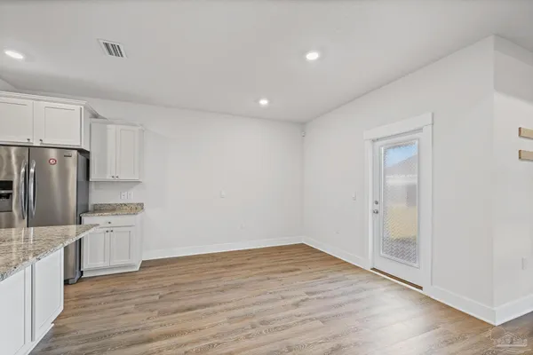 a view of an house that has a swimming pool with a yard