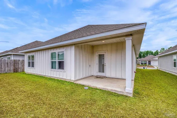 a front of a house with a yard