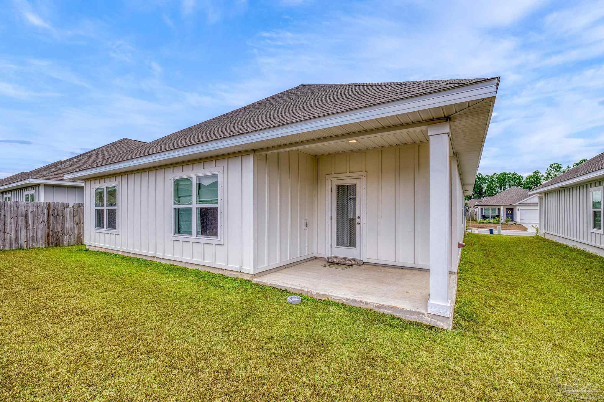 4074 Blaney Lane Pace, FL 32571 - Photo 50 of 59 front view of a house with a yard