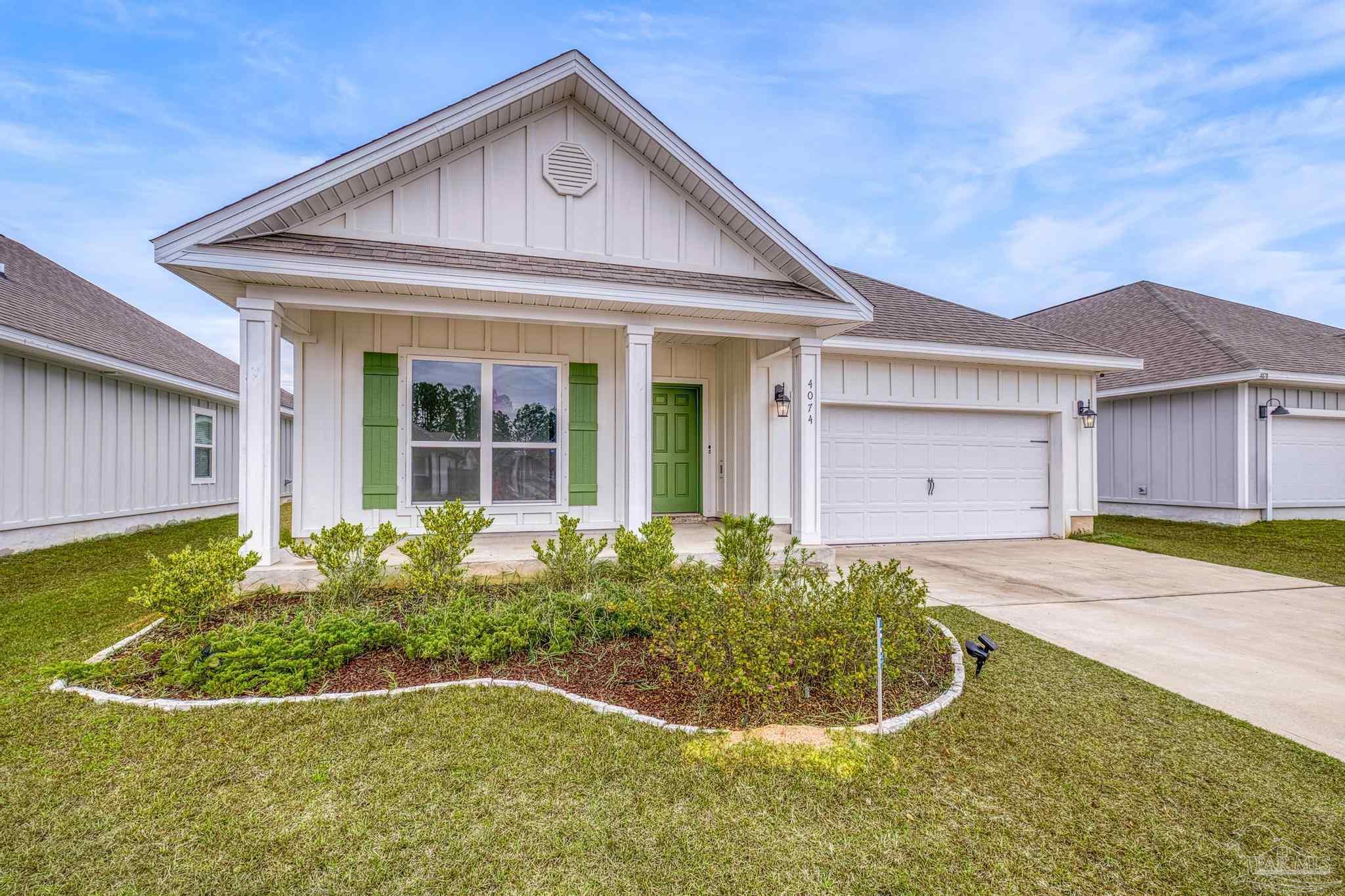 4074 Blaney Lane Pace, FL 32571 - Photo 5 of 59 a view of a house with backyard and garden
