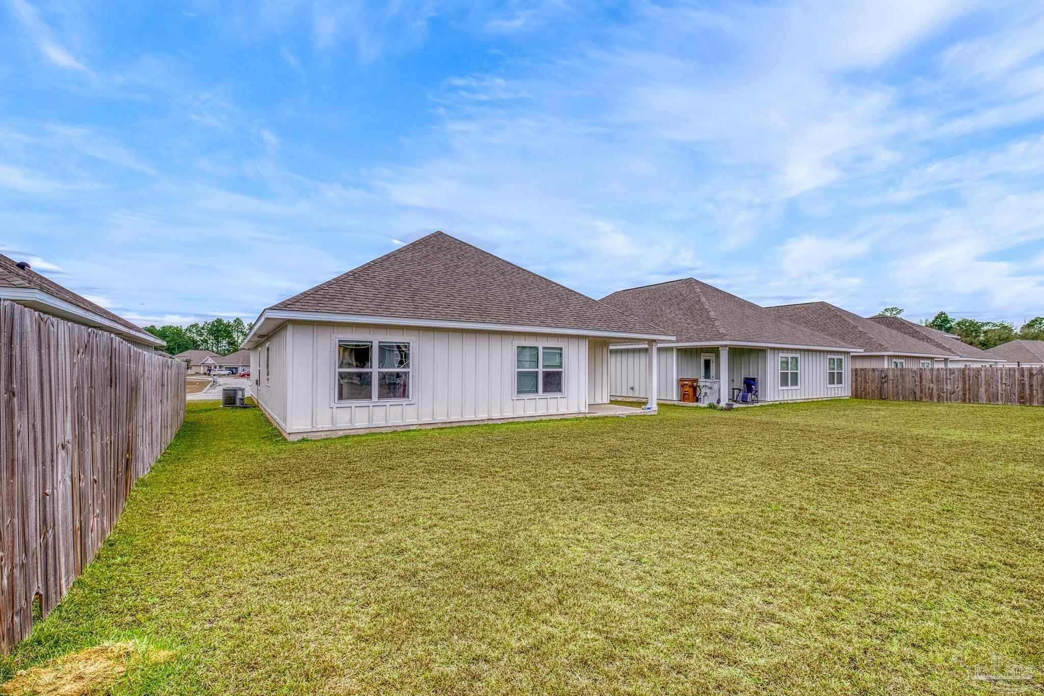 4074 Blaney Lane Pace, FL 32571 - Photo 55 of 59 a front of a house with a yard