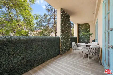 a view of roof deck with patio
