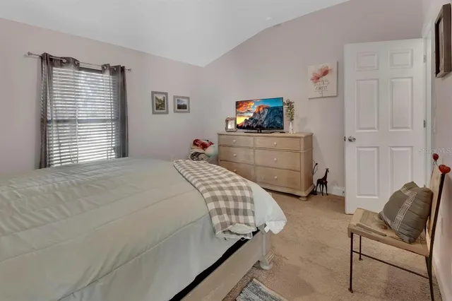 a bedroom with a bed and furniture