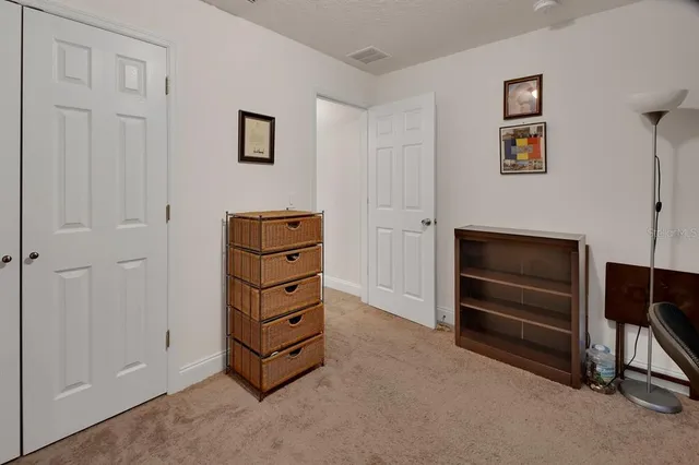a view of room with furniture and a ceiling fan