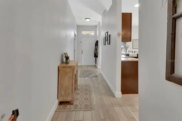 a view of a kitchen from the hallway