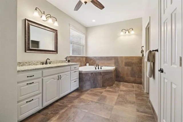 a bedroom with a bed and glass door