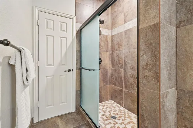 a spacious bathroom with a sink a mirror and a bathtub