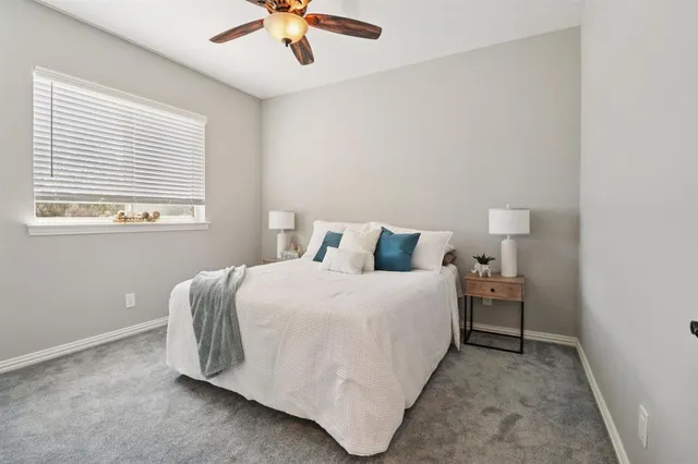 a room with a sink cabinets and a window