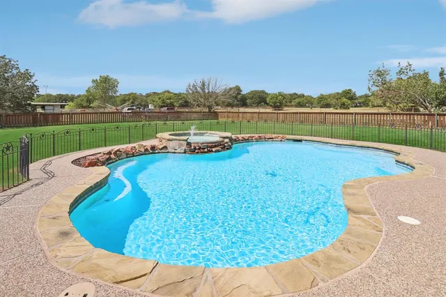 a view of a lake with a bench in front of it