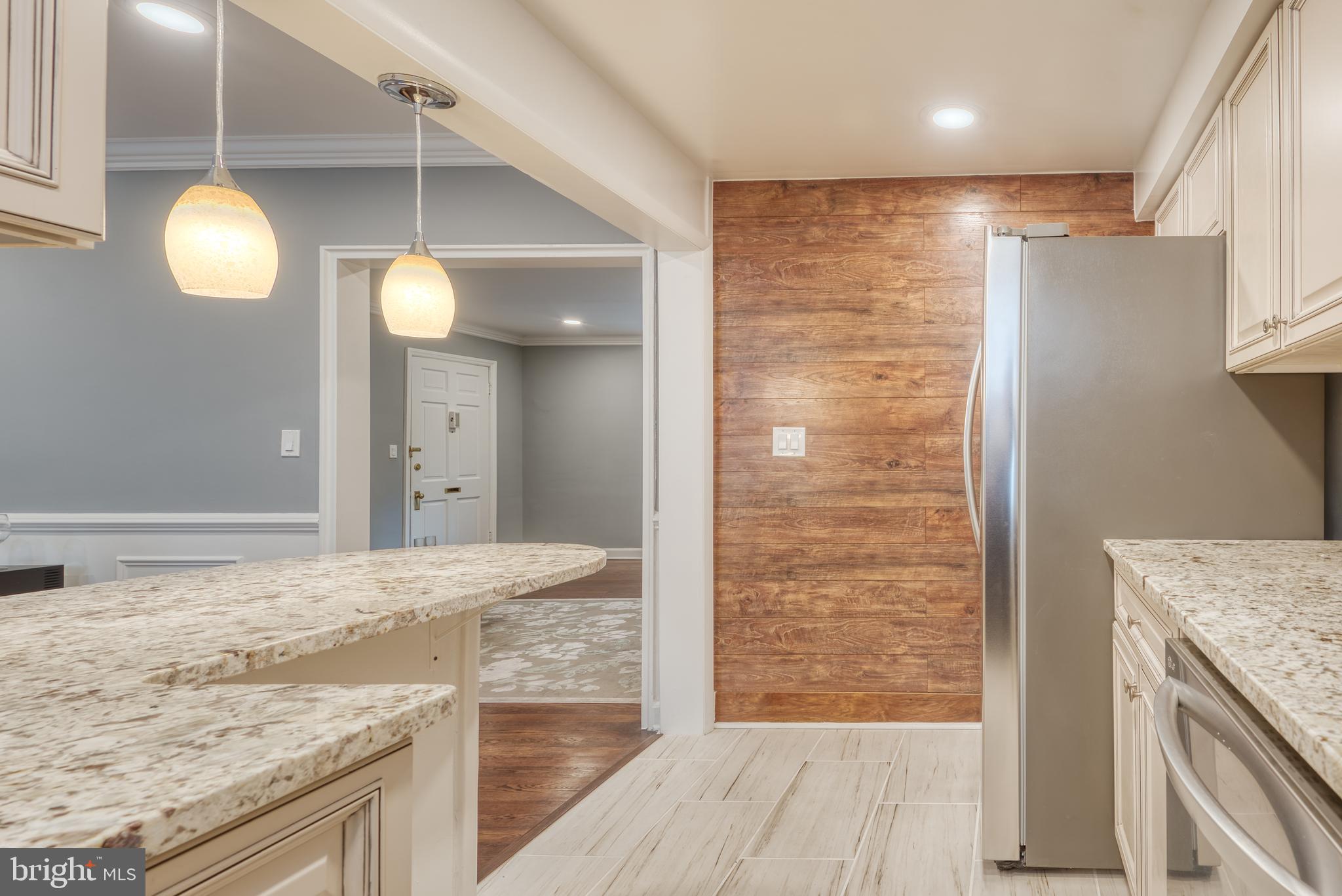 5203 Falls Road, Unit 5 Baltimore, MD 21210 - Photo 6 of 27 Kitchen w/ Wood Accent Wall
