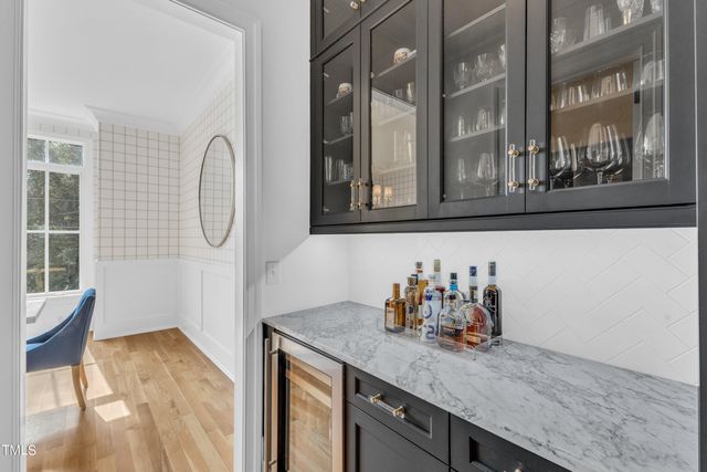 a kitchen with sink and cabinets