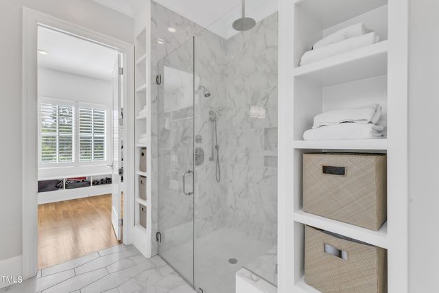 a bathroom with a shower and a sink