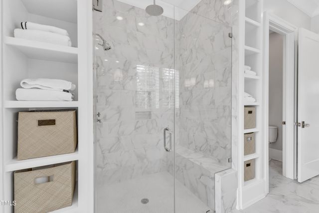 a bathroom with a shower and a sink