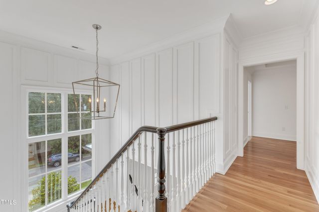 a view of a hallway with windows