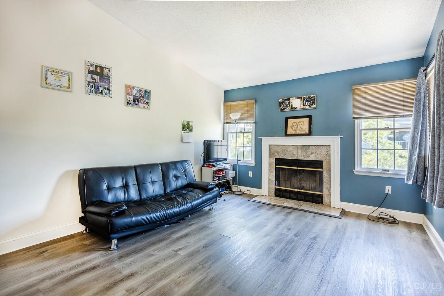 930 Edpas Road New Brunswick, NJ 08901 - Photo 6 of 13 a living room with furniture and a fireplace