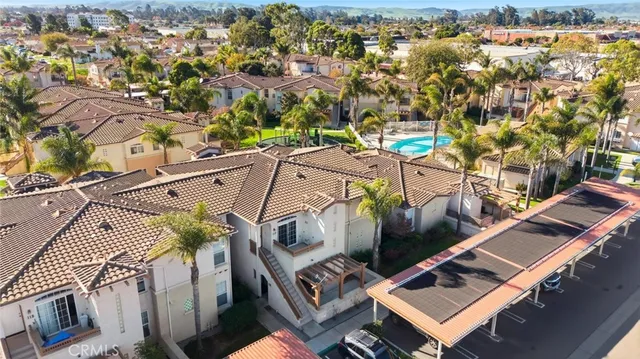 an aerial view of a house with outdoor space