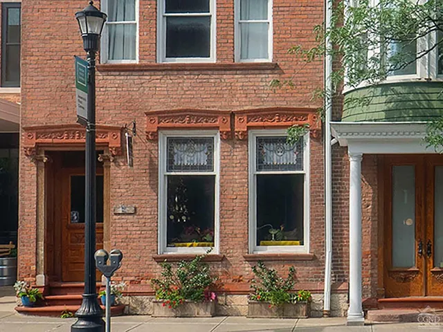 front view of a brick house with a window