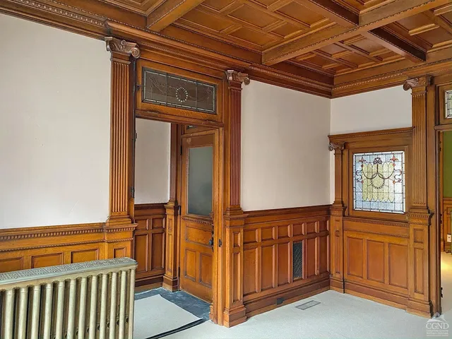 a view of a porch with wooden floor