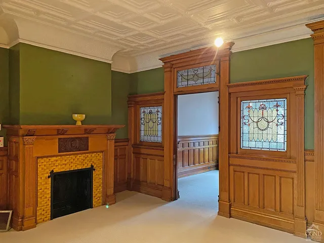 a view of livingroom with furniture and a fireplace
