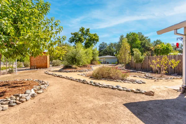 a view of a backyard of the house