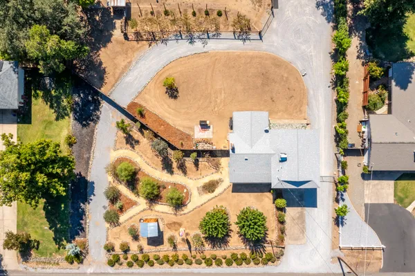 an aerial view of residential houses with outdoor space