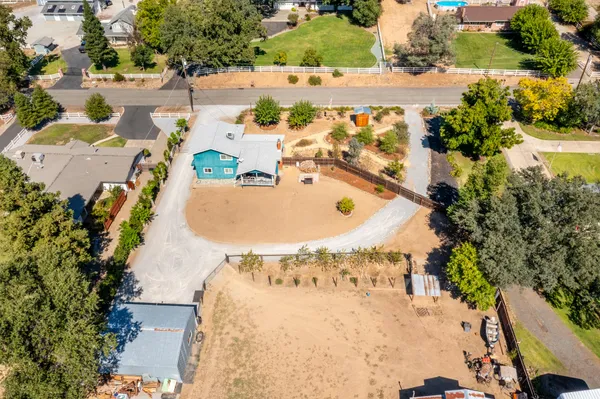 an aerial view of a house with a swimming pool