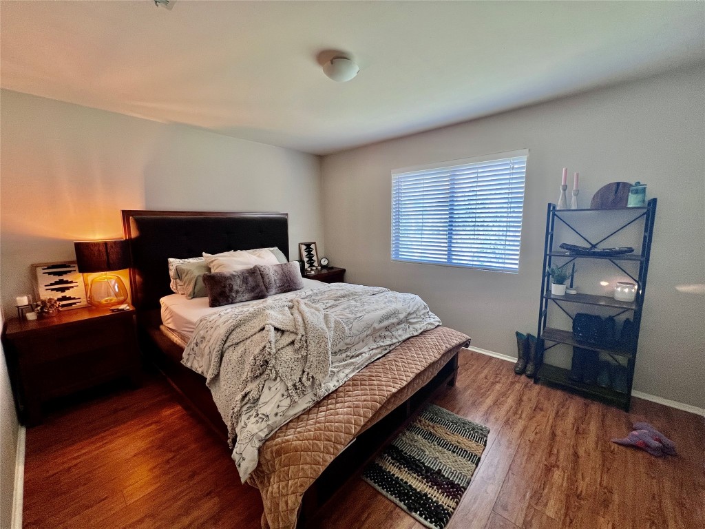 744 Wales Way Austin, TX 78748 - Photo 12 of 15 a bedroom with a bed and wooden floor