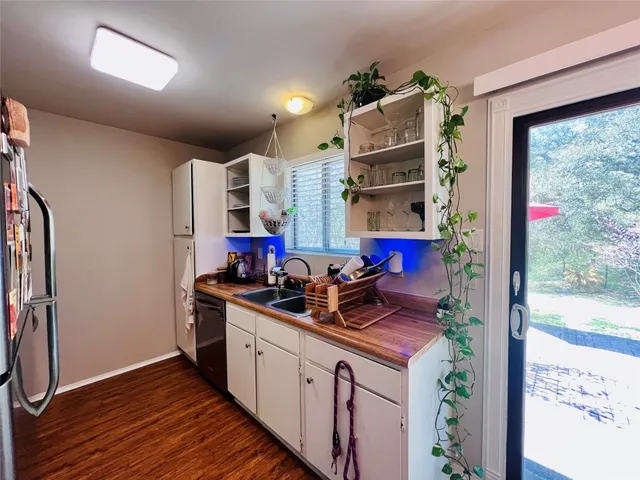 a kitchen with stainless steel appliances granite countertop a stove and a refrigerator