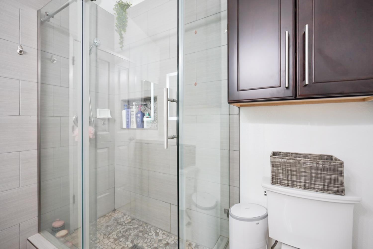 1421 Riverette Drive Modesto, CA 95351 - Photo 18 of 32 a bathroom with a toilet and a shower