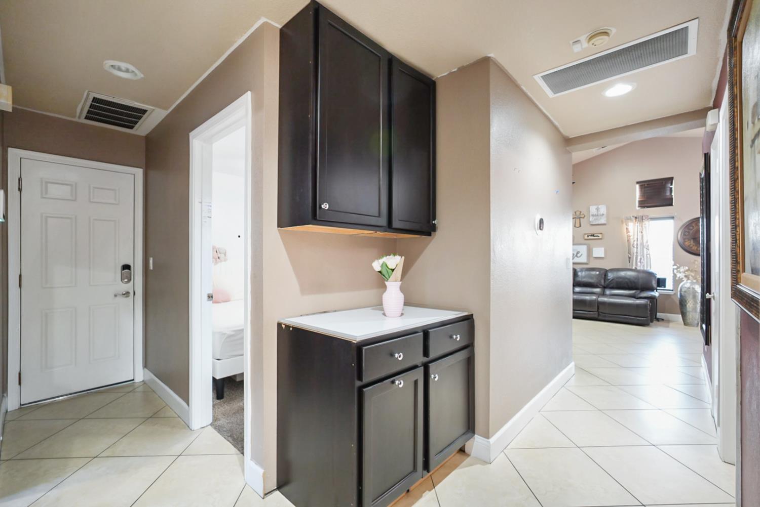 1421 Riverette Drive Modesto, CA 95351 - Photo 19 of 32 a view of a kitchen cabinets and a kitchen