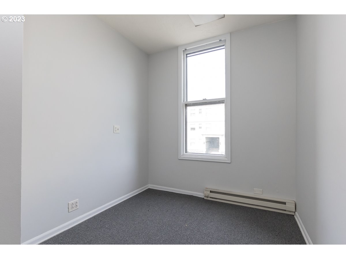 1326 Southwest 12th Avenue Portland, OR 97201 - Photo 11 of 33 an empty room with a window
