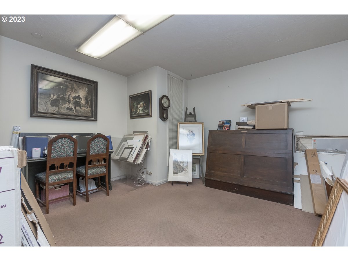 1326 Southwest 12th Avenue Portland, OR 97201 - Photo 15 of 33 a bedroom with furniture and a chair