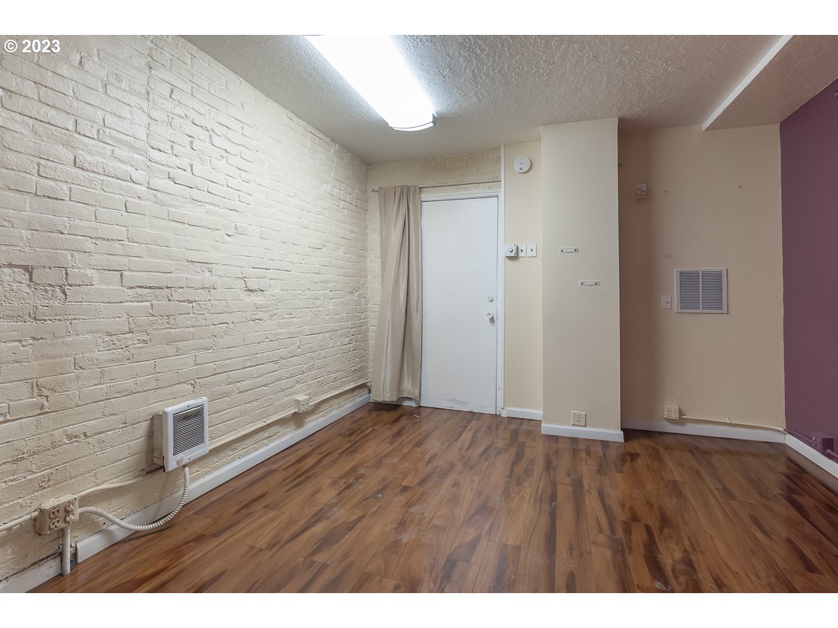 1326 Southwest 12th Avenue Portland, OR 97201 - Photo 28 of 33 a view of an empty room with wooden floor