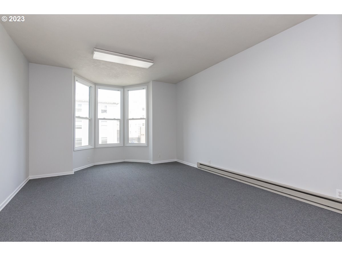 1326 Southwest 12th Avenue Portland, OR 97201 - Photo 8 of 33 a view of an empty room with a window