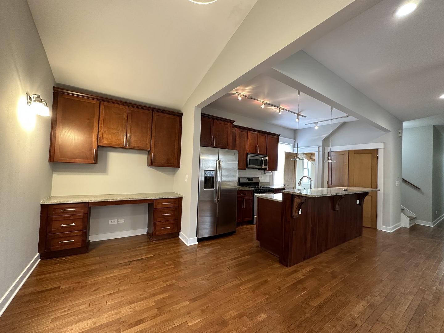 Undisclosed Address Chicago, IL 60613 - Photo 3 of 12 a kitchen with stainless steel appliances granite countertop a refrigerator and stove top oven