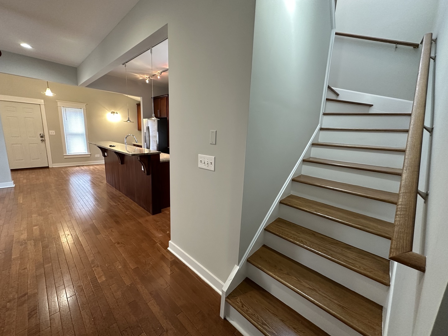 Undisclosed Address Chicago, IL 60613 - Photo 6 of 12 a view of entryway and hall with wooden floor