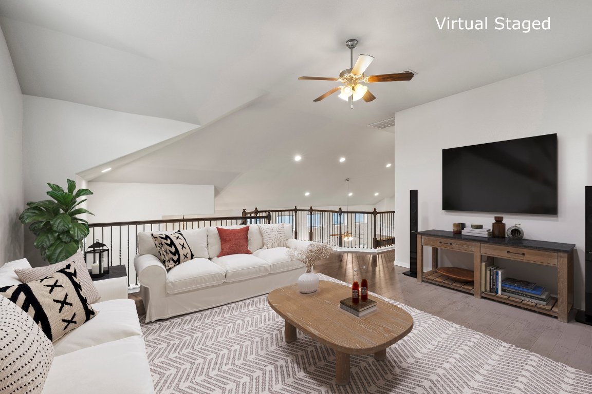 7337 Menchaca Road, Unit 22 Austin, TX 78745 - Photo 18 of 23 a living room with furniture and a flat screen tv