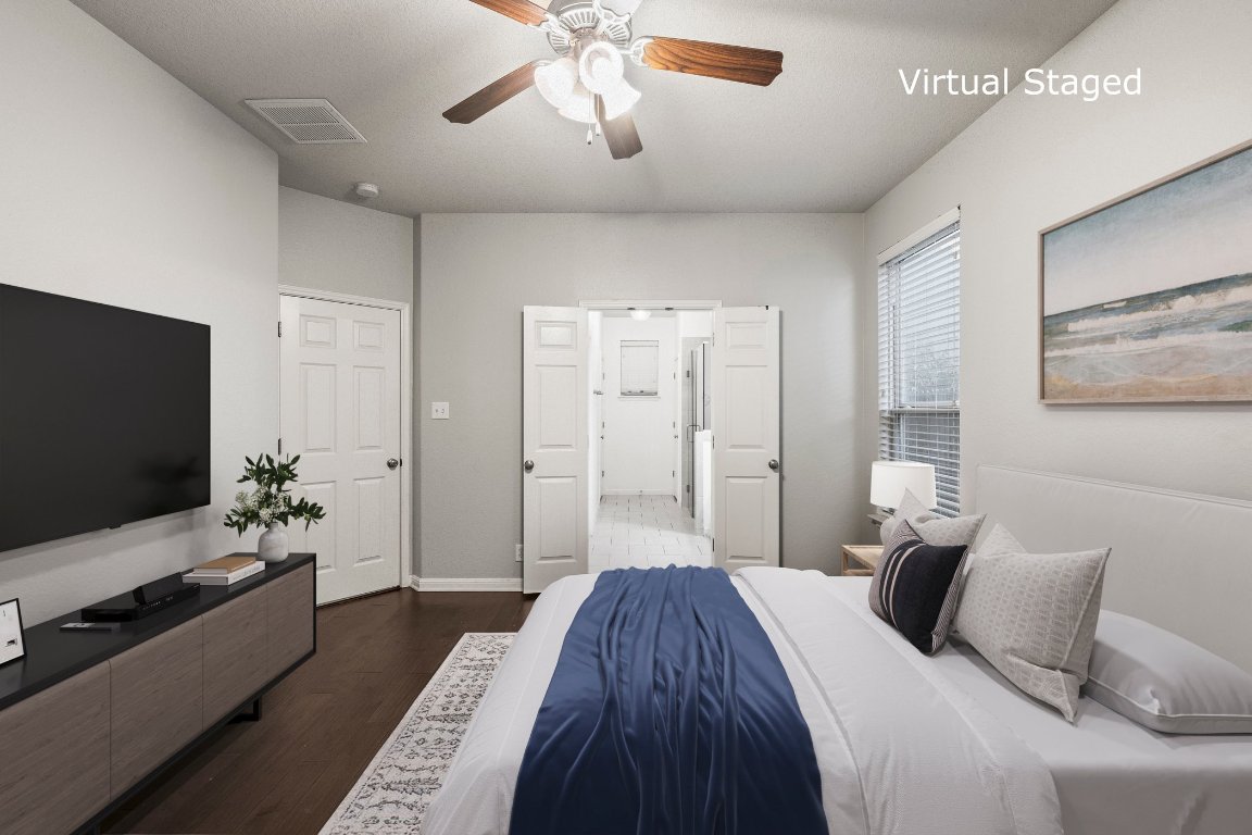 7337 Menchaca Road, Unit 22 Austin, TX 78745 - Photo 9 of 23 a bedroom with a bed and a flat screen tv