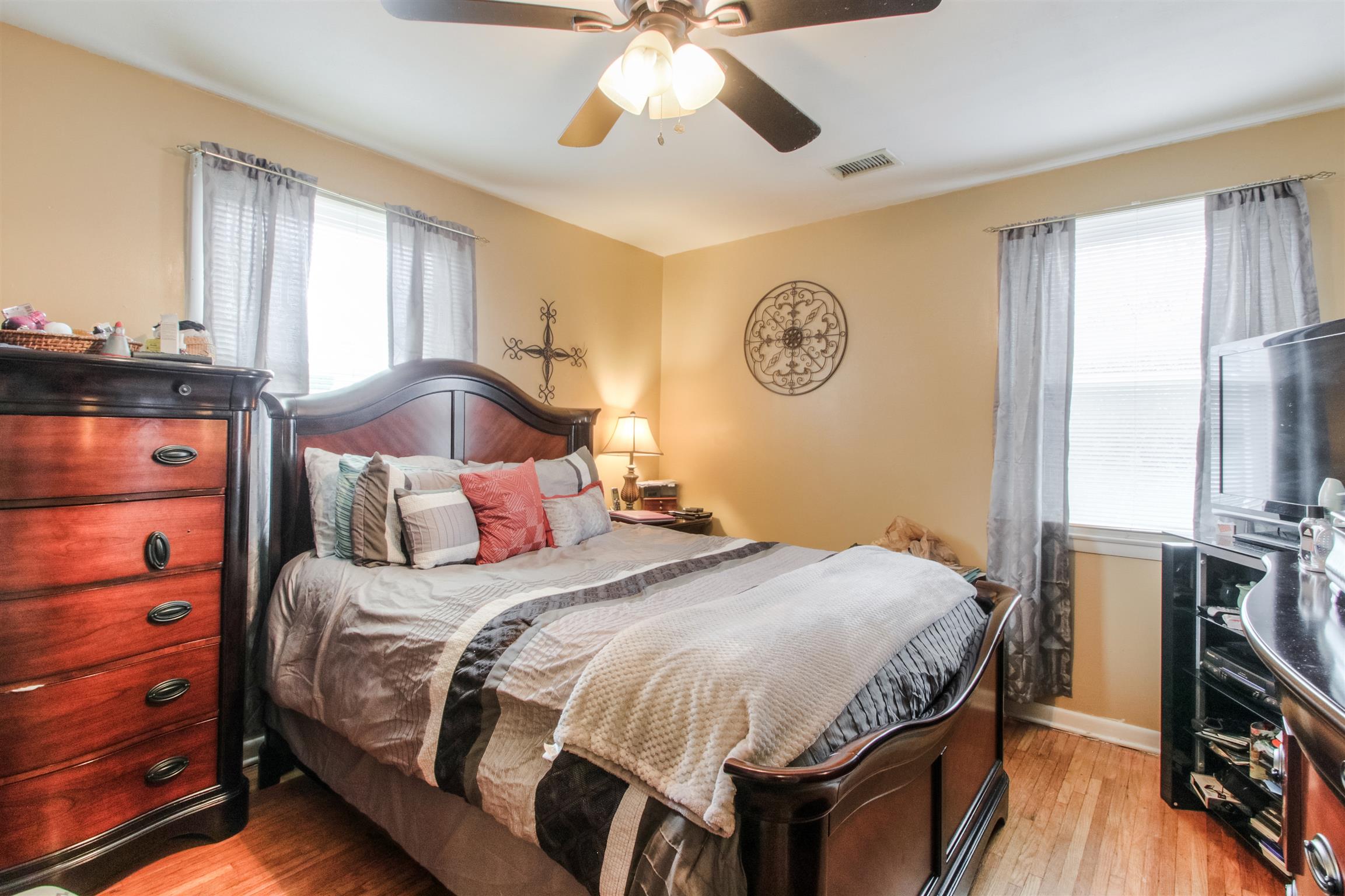 917 Mitchell Road Nashville, TN 37206 - Photo 11 of 19 a bedroom with a bed and a chandelier