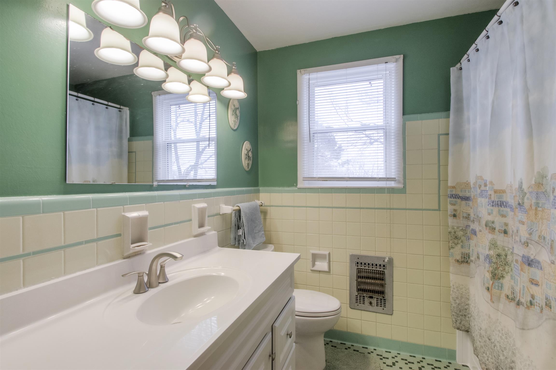 917 Mitchell Road Nashville, TN 37206 - Photo 12 of 19 a bathroom with a toilet sink and mirror