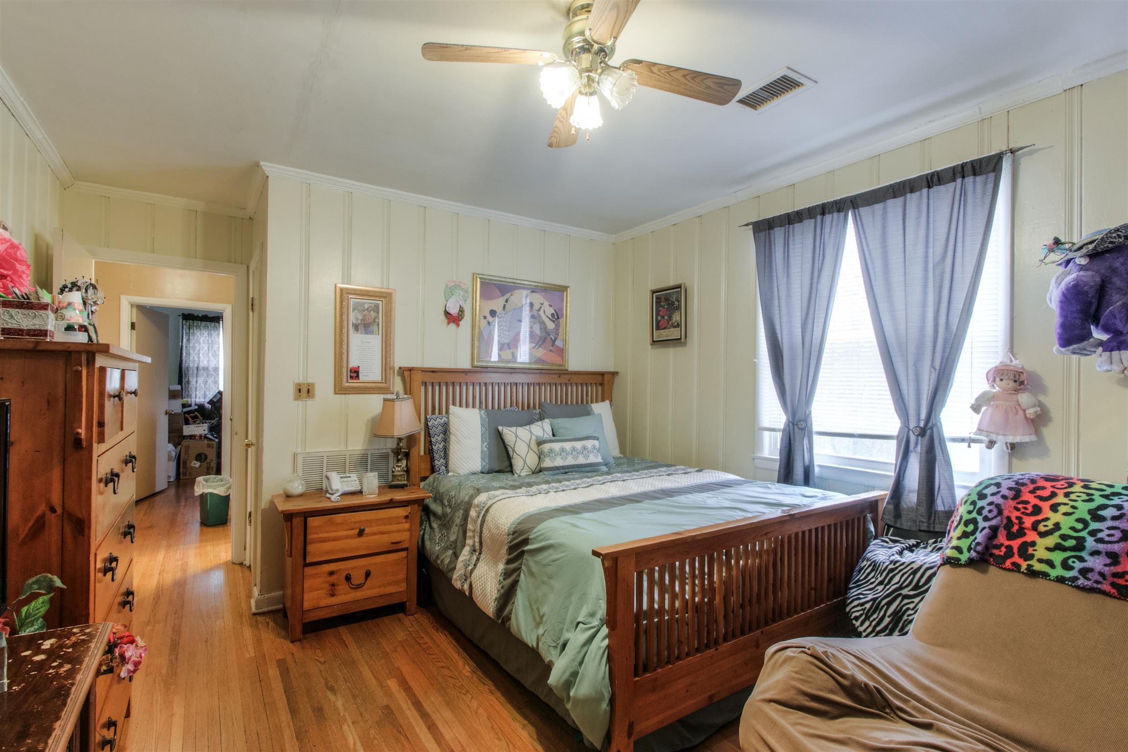 917 Mitchell Road Nashville, TN 37206 - Photo 13 of 19 a bedroom with a bed and wooden floor
