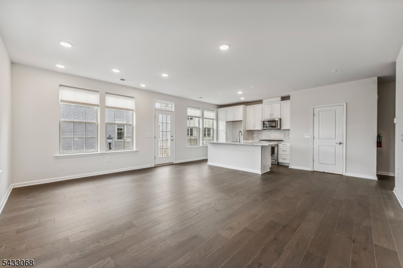 3 Sternadori Road Somerville, NJ 08876 - Photo 7 of 22 a view of an empty room with a window and wooden floor