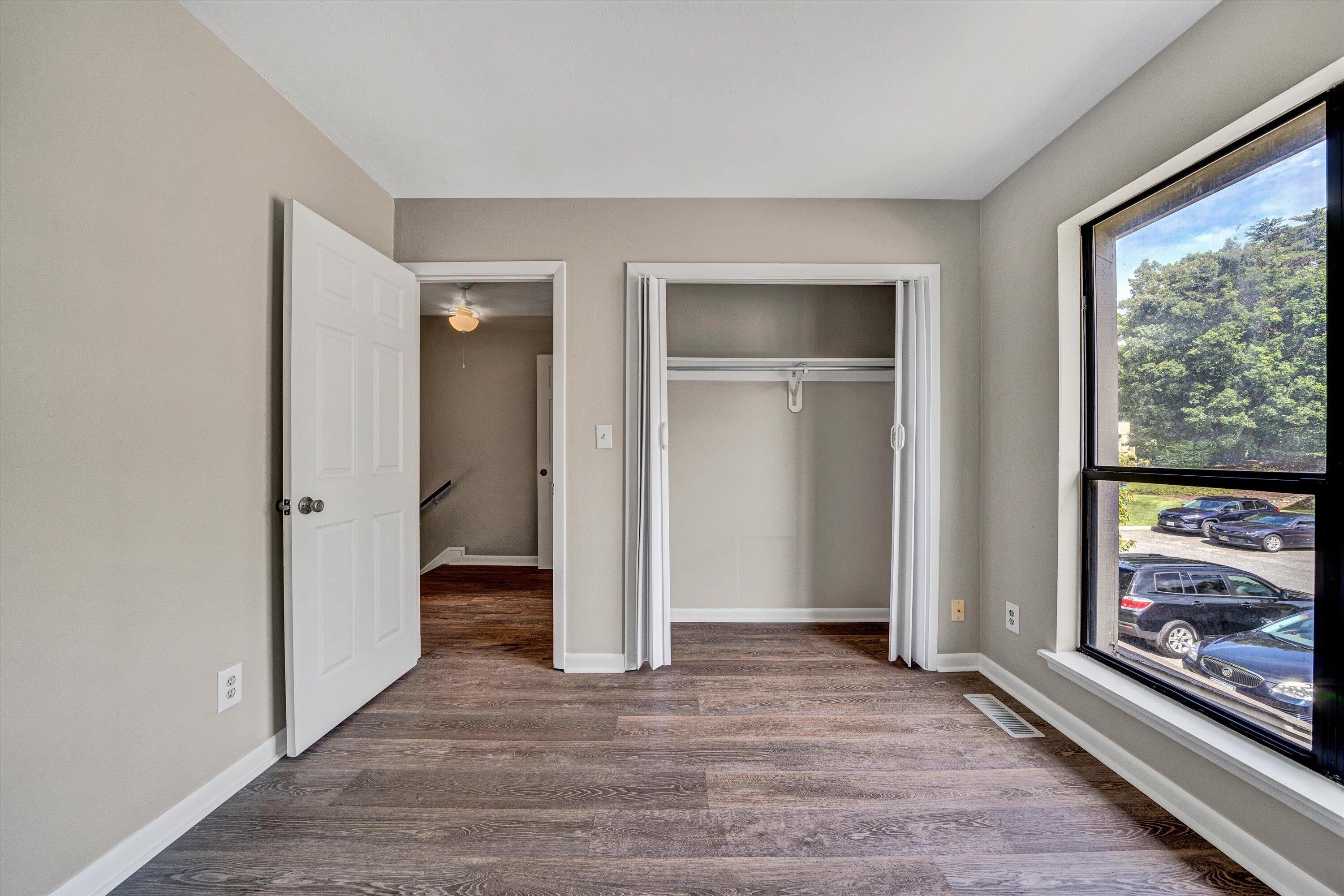 7311 Maple Court Southwest Roanoke, VA 24018 - Photo 22 of 41 a view of an empty room with window and wooden floor