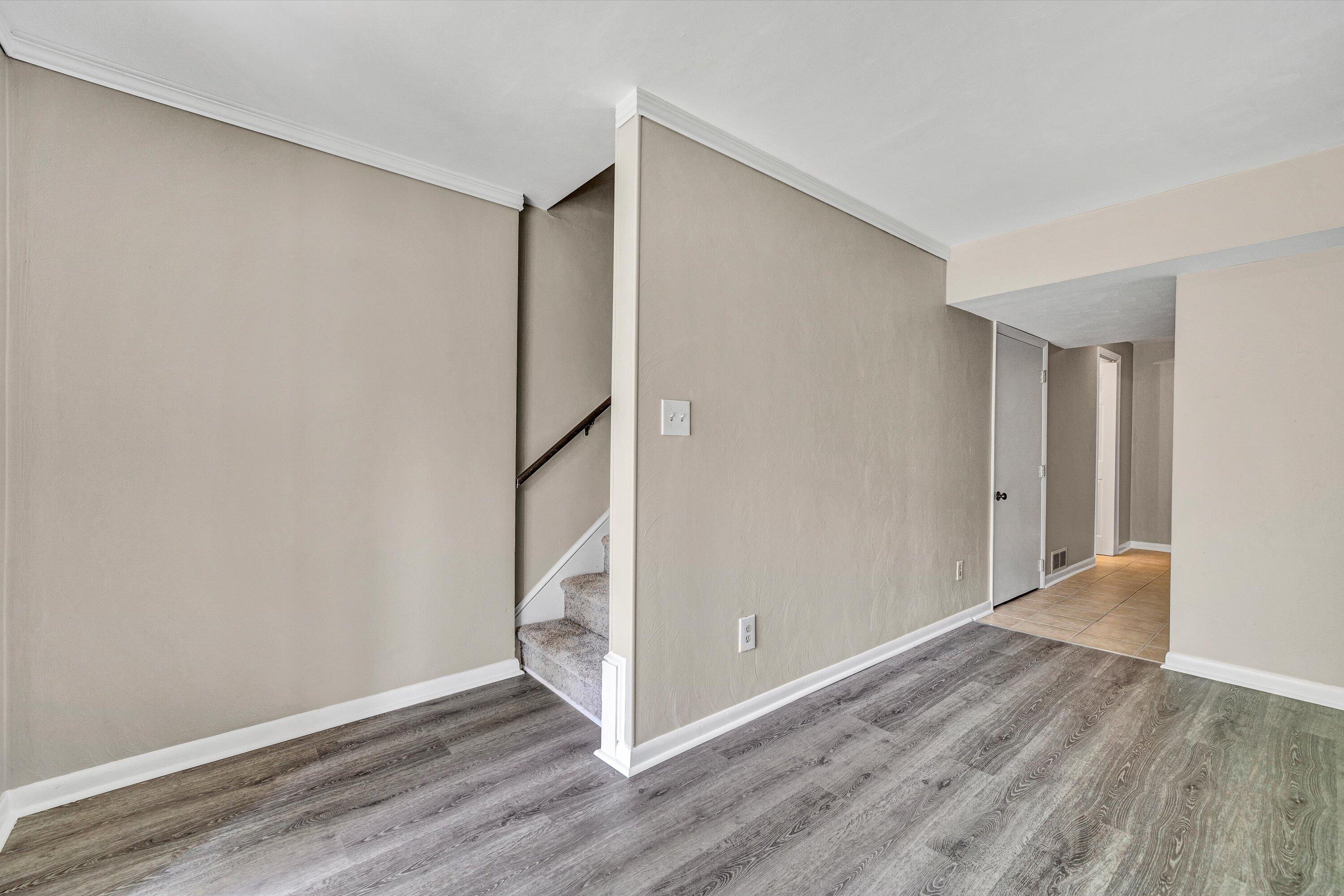 7311 Maple Court Southwest Roanoke, VA 24018 - Photo 27 of 41 a view of an empty room with wooden floor and a window