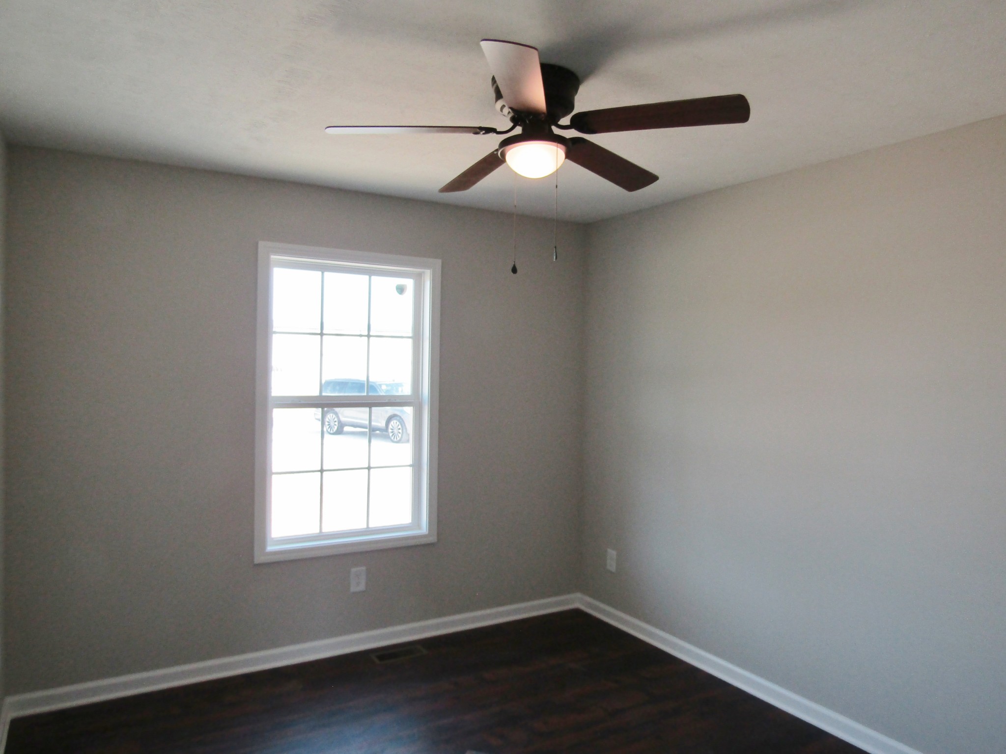 1719 Old Belfast Road Lewisburg, TN 37091 - Photo 11 of 14 an empty room with wooden floor fan and windows