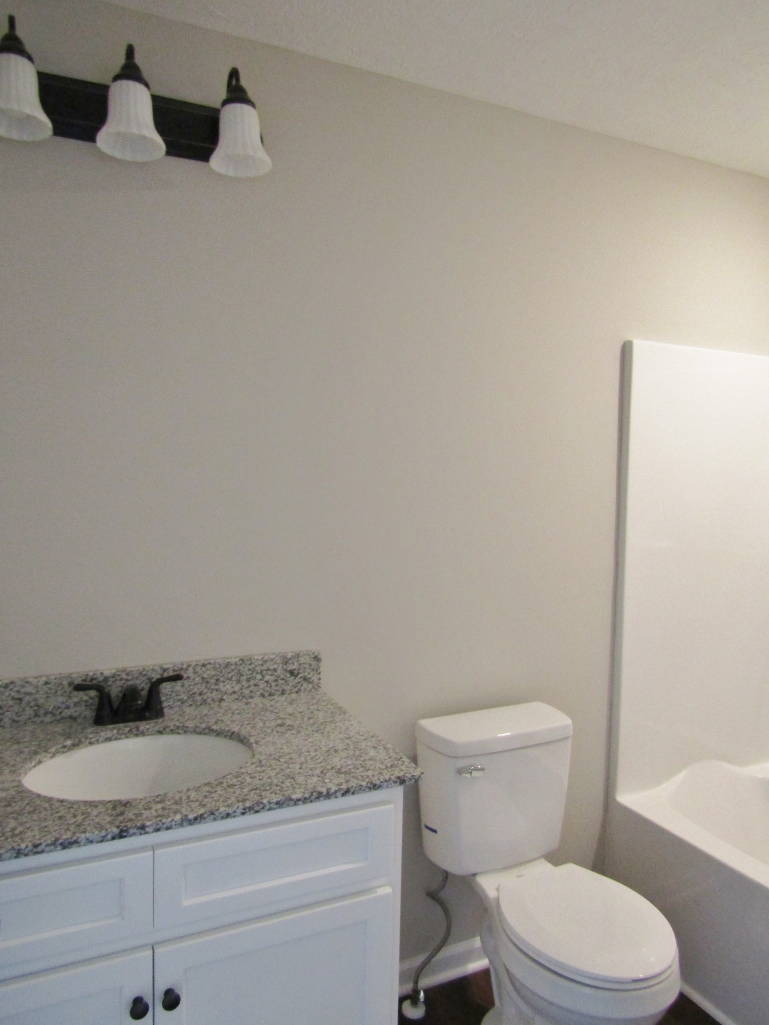 1719 Old Belfast Road Lewisburg, TN 37091 - Photo 14 of 14 a bathroom with a granite countertop toilet and sink