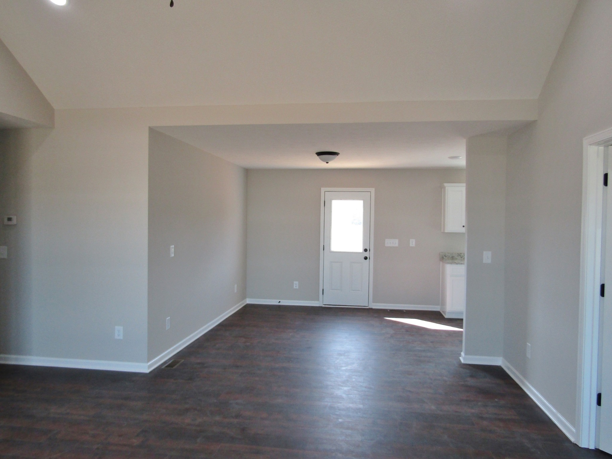 1719 Old Belfast Road Lewisburg, TN 37091 - Photo 3 of 14 a view of an empty room with wooden floor and a window