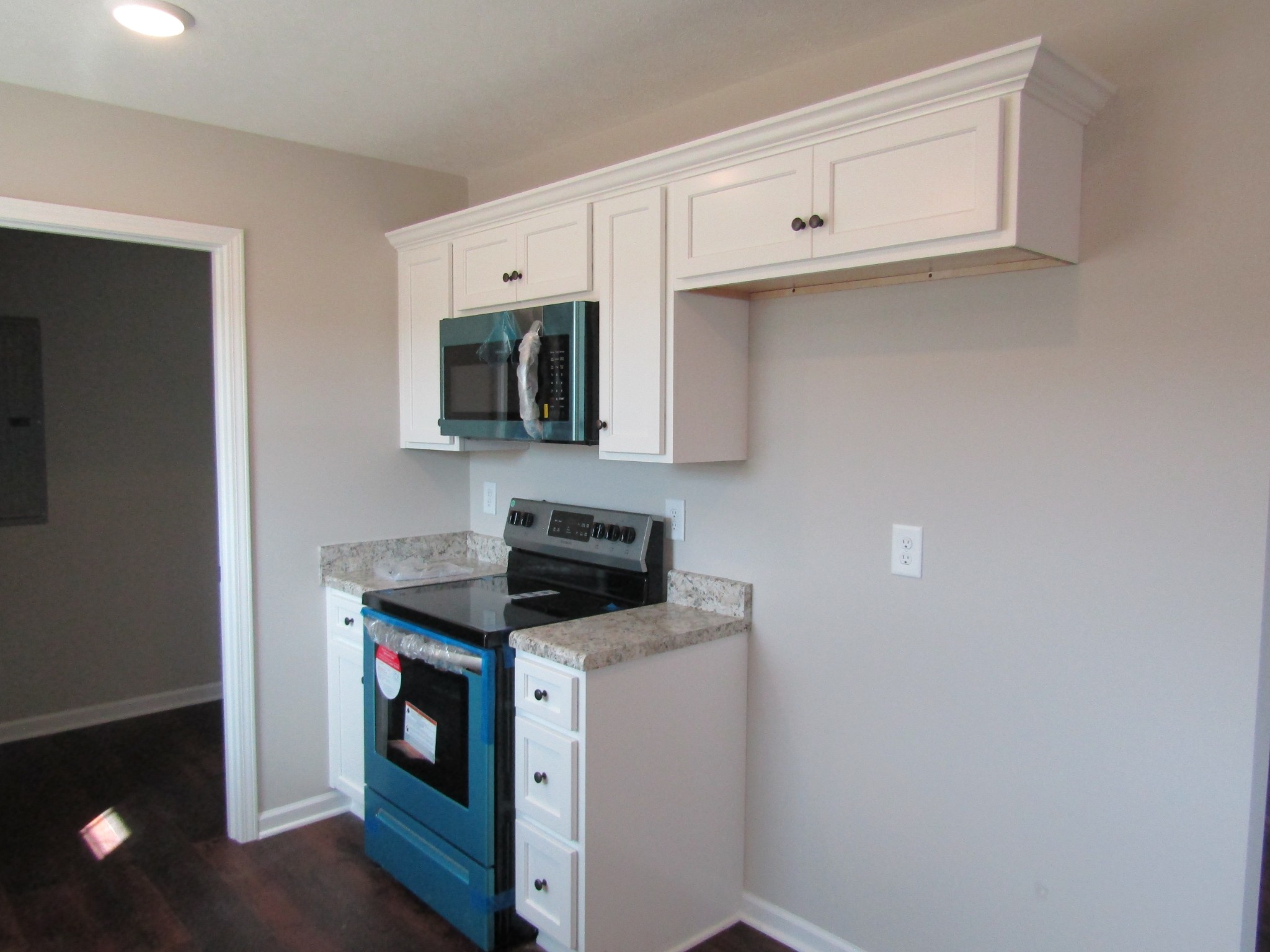 1719 Old Belfast Road Lewisburg, TN 37091 - Photo 7 of 14 a kitchen with cabinets stainless steel appliances and wooden floor